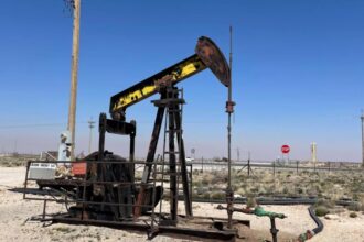 Crude trades flat over hopes of no spillover