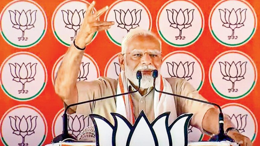 Modi again warns of Congress plot; EC mum