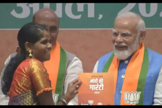 PM Narendra Modi presents manifesto to Bastar's daughter Neelavati Maurya | India News