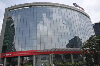 RBI bars Kotak Mahindra Bank from onboarding fresh customers via online, mobile banking; asks it to stop issuing fresh credit cards