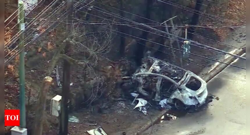 Two dead after Tesla crashes into rock barrier and catches fire in New York