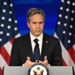 'Manhandled by two or three people': Journalist dragged out for heckling Blinken - video