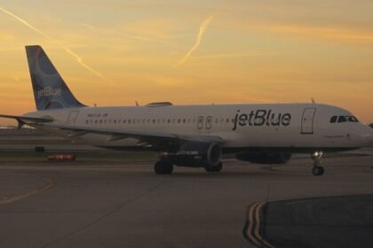 Passenger opens plane exit door at Boston airport after 'argument with girlfriend', sparks panic