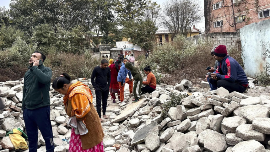 People run out of buildings as walls collapse